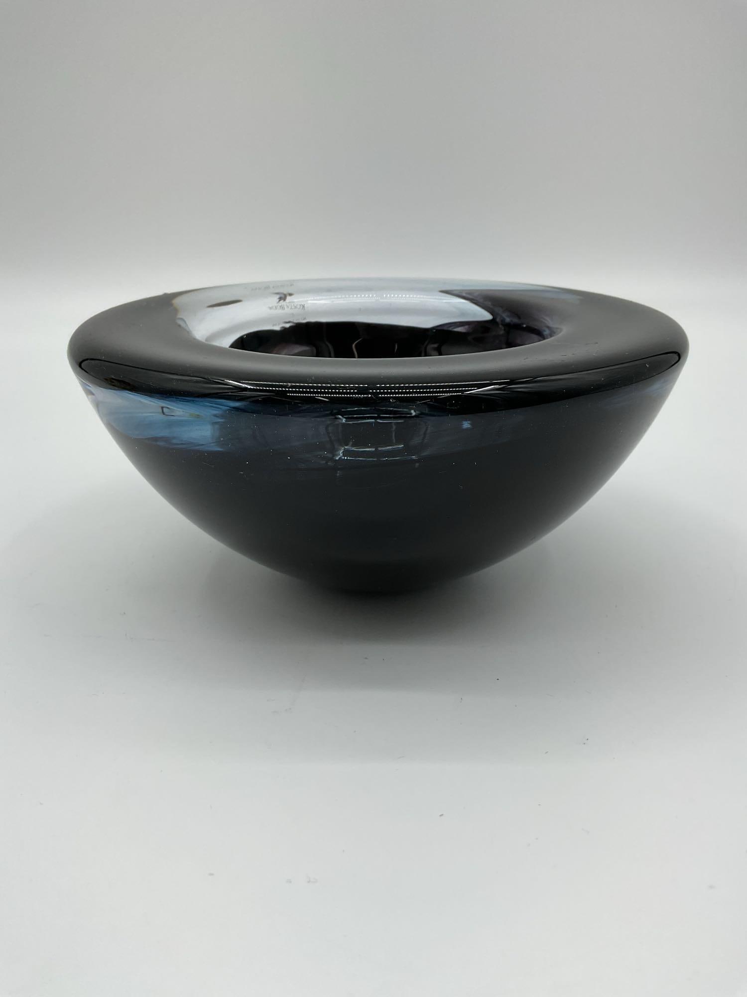 Kosta Boda "Atoll" Black Art Glass Bowl: Elegant Kosta Boda black art glass bowl featuring a smooth, rounded modern form with deep center well. Crafted in Sweden by the renowned glassworks founded in 1742. Signed with the Kosta Boda mark on