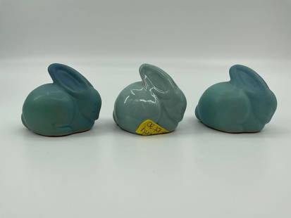 Van Briggle Pottery Sleeping Rabbits, Set of Three: Set of three small Van Briggle pottery figures depicting sleeping rabbits, crafted in the signature matte turquoise blue glaze. Each figure is modeled in a curled resting position with elongated ears