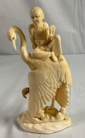 Elder Riding Crane Figurine