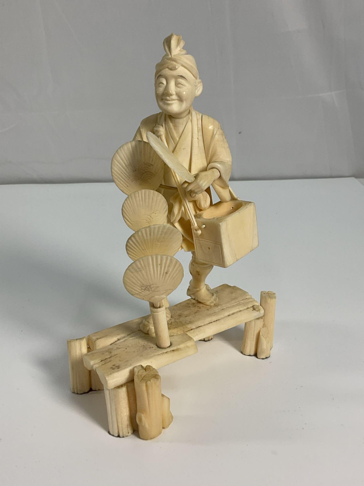 Japanese Bone Carving - The Shopper: Old Man Salesman Dimension: H7in L5in W3in approx