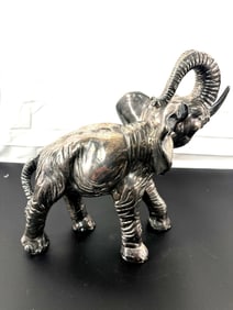 "Vintage Black Ceramic Elephant Figurine with Raised Trunk" - Israel