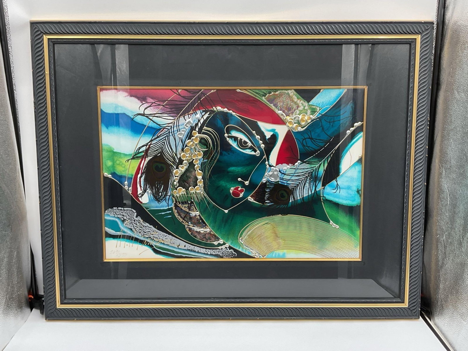 Emerald Elegance by Martiros Manoukian(Armenia, b.1947) Serigraph: Description: A striking limited edition serigraph by Martiros titled Emerald Elegance, featuring an abstract female portrait enriched with vibrant colors, metallic embellishments, and surreal detailin