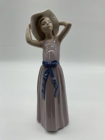Lladro Girl Adjusting Hat Figurine