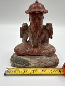 Carved Stone Figure of a Seated Sage