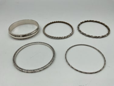 Collection of Five Vintage Silver-Tone and Twisted Metal Bangles