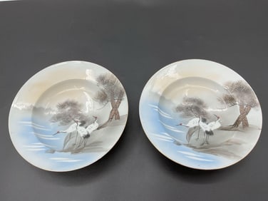 Pair of Hand-Painted Porcelain Plates with Crane and Landscape Design