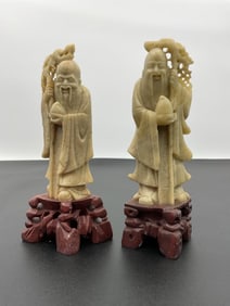 Pair of Carved Soapstone or Jade Immortal Figures on Wooden Stands