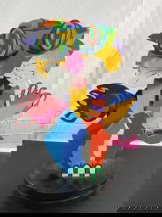 Abstract Colorful Wood Sculpture by Chas Brice (1996): A bold and vibrant abstract sculpture signed &#34;Chas Brice 96.&#34; The piece features an energetic mix of geometric and organic shapes painted in bright primary and secondary colors. The playful, l