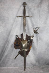 4 Piece Metal Armor Set: This striking medieval-style display piece features an ensemble of a large sword, halberd, and a decorative breastplate, perfect for collectors or enthusiasts of historical weaponry.Sword: A long, age