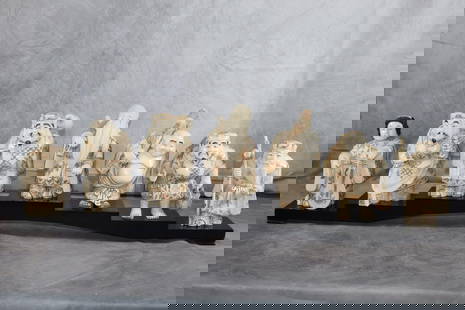 The Seven Lucky Gods, Shichifukujin,: This is a collection of seven figurines representing the Seven Lucky Gods of Japanese mythology. Each figure appears to be intricately carved, likely from a material resembling ivory or resin, and is