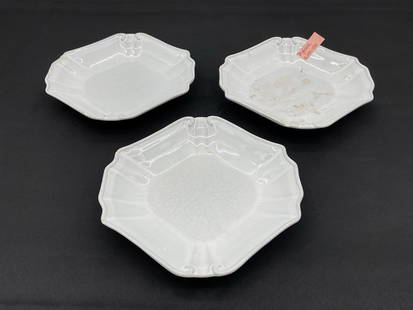 Set of Three White Tyler Florence Chef's Dessert Plates: Trio of octagonal white ironstone plates with embossed scrollwork at the corners and light crazing throughout the glaze. Dimensions: L8in W8in Medium: Glazed ironstone ceramic Condition: A few