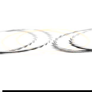 18K Yellow Gold Pair of White & Black Diamond Bangles: 18K Yellow Gold Pair of White & Black Diamond Bangles Weighing 10.2 grams Set with app. 1.25 Ct. of Diamonds F-H Color, VS1-SI1 Clarity Along with app. 1.25 Ct. of Black Diamonds Fits app. 7.5 inch wr