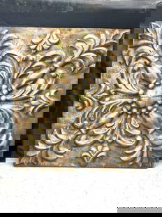 Ornamental bronze-style wall panel: Decorative square wall panel featuring an embossed floral and scroll motif with an antiqued bronze and gold finish Dimensions: H4ft L4ft Medium: Molded composite or metal with painted patina finish
