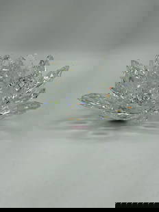 Swarovski Crystal Lotus Flower Candle Holder: Sparkling crystal lotus flower with faceted petals, designed to hold a small candle or tealight in the center. Reflects light beautifully in all directions. Dimensions: H3in Dia5in Medium: Swarovski c
