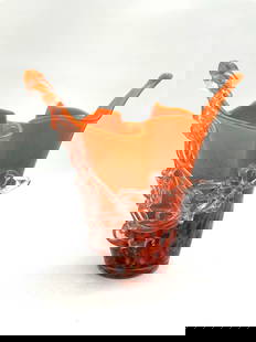 Murano Style Orange Art Glass Vase with Clear Ribbon Detail - Signed, Artist Unknown: Freeform blown glass vase in vivid orange with abstract black speckles and applied clear ribbon-like decoration. Dimensions: H9in L8in W8in Medium: Blown art glass