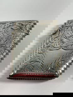 Antique (1898) sterling silver vesta case: This is an intricately engraved antique silver vesta case, featuring detailed floral and scrollwork patterns on both sides. One side showcases an elegant shield-shaped cartouche, which is blank and re