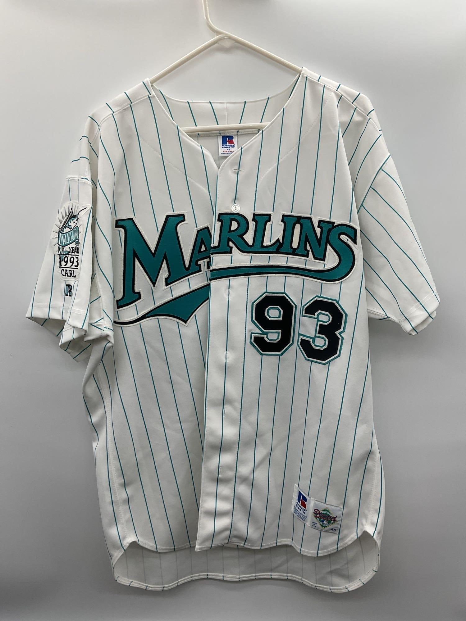 1993 Florida Marlins Inaugural Season Pinstripe Jersey: A vintage 1993 Florida Marlins white pinstripe jersey, marking the team’s inaugural season in Major League Baseball. Features the classic "Marlins" script logo across the chest, teal and bla