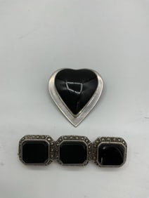 Pair of Vintage Onyx and Silver Tone Brooches