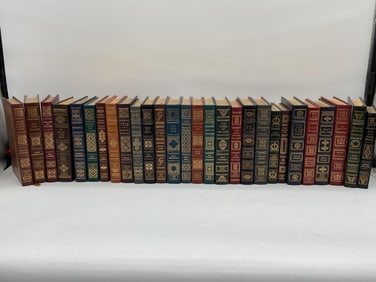 Collection of Signed First Edition Leather-Bound Books with Gilt Detailing.