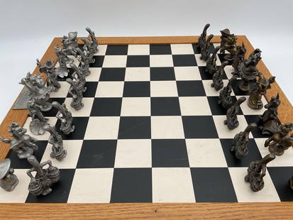 Walt Disney Fantasia Limited Edition Chess Set: Description: This chess set commemorates the 1940 animated feature film &#34;Fantasia&#34; by Disney. Includes sculpted metal character pieces stored in a fitted velvet-lined wooden box. Set is number