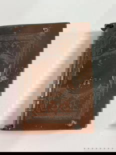 Antique vesta case (match safe) 23: Description: This is an antique match safe (vesta case) designed in the form of a book, featuring a hinged spine. The cover is embossed with the initials &#34;F.E.U.&#34;, framed by intricate decorati