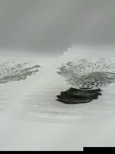 Pressed Glass Compote Dish with Metal Base: Description: Small pedestal compote featuring a scalloped edge and diamond-cut pressed glass bowl mounted on a silver-toned metal base. Ideal for candy, nuts, or display. Dimensions: H:3in Dia:6in <
