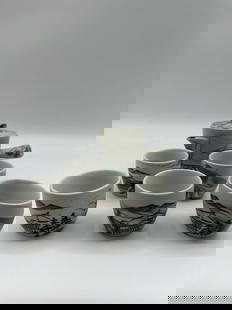 Japanese Ceramic Tea Set (6pc): Hand-painted ceramic tea set featuring a teapot with lid and five matching cups. Each piece displays a traditional landscape scene with temples, mountains, and pine trees in subtle green and black ton
