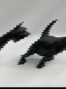 Cast Iron Scottish Terrier Dog Doorstop: Description: Heavy cast iron doorstop in the form of a Scottish Terrier. Nicely detailed with original black paint showing natural wear from age. Likely mid-20th century. A charming decorative piece o
