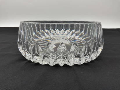 Cut Crystal Bowl: A stunning round-cut crystal bowl featuring deep, symmetrical cuts and a radiant starburst pattern on the base. This versatile piece can serve as a centerpiece, fruit bowl, or decorative display. H3in