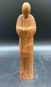 Minimalist Wooden Figure in Prayer
