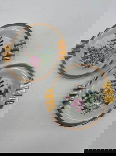 Pair of Kutani Porcelain Ashtrays with Floral Motif and Gold Handles: Description: Set of two hand-painted white porcelain ashtrays featuring hand-painted floral designs and gold-tone handles. Dimensions: H:1in L:6in W:6in
