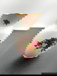 Miniature Porcelain Bud Vase with Multicolor Rose Bouquet: This is a small porcelain bud vase featuring a floral motif of red, yellow, and pink roses with green foliage. The rim is trimmed in gold, giving it a refined and decorative touch. Likely a vintage pi