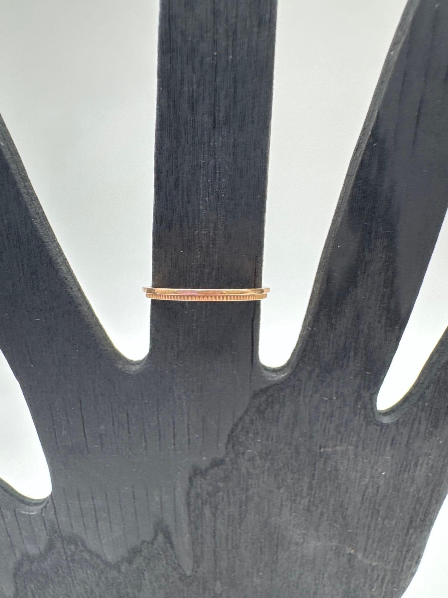 14K Rose Gold Band Ring: Sleek and minimal, this thin 14K Rose gold band features a polished flat profile ideal for stacking or wearing solo. Stamped "14K" on the inner band, it is a classic and versatile accessory fo