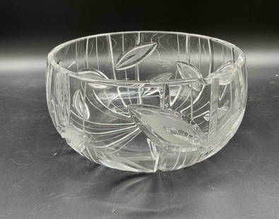Cut Crystal Bowl with Leaf Motif: Description: Round crystal bowl with vertical panel cuts and stylized leaf patterns around the sides and base. Clear and bright with good weight, but has a visible chip along the rim. Medium: Cut crys