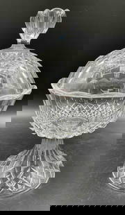 Cut Crystal Covered Compote on Pedestal: Description: Elegant footed compote with dome lid featuring a faceted finial. Deep cut patterns include diamonds, fans, and leaf motifs, all on a flared pedestal base. Ideal for display or serving. Me