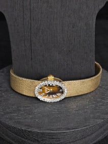 Universal Genève Ladies' 18K Gold Watch with Diamond Bezel and Tiger Eye Dial