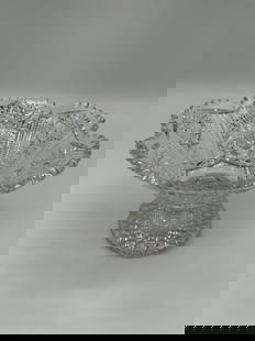 Pressed Glass Pedestal Compote Bowl: This elegant pedestal compote bowl is crafted from clear pressed glass and features intricate geometric and starburst patterns throughout. The scalloped rim adds a refined touch, while the elevated ba