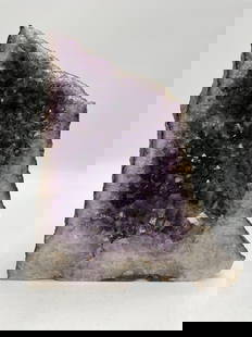 Large Amethyst Geode Cluster: Natural amethyst crystal geode with rich purple coloration and well-defined crystal formations. Display piece with raw exterior and polished base for stability. Dimensions: H:13in L:11in W:6in Medium: