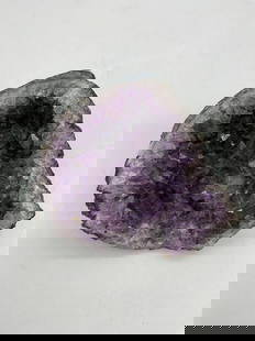 Medium Amethyst Geode Slice: Irregularly shaped amethyst geode with deep violet crystals and natural matrix edges. Smaller display or healing crystal specimen. Dimensions: H3in L5in W5in Medium: Natural mineral specimen (Amethyst