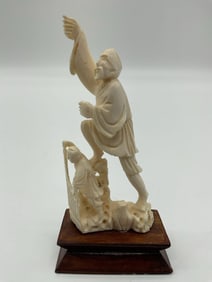 Carved Asian Figurine of Man on Boat