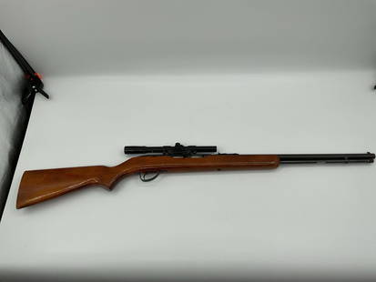 Savage Arms Model 187 .22 Long Rifle with Scope: Savage Arms Model 187 semi-automatic rifle chambered in .22 Long Rifle. Features a hardwood stock, tubular magazine, and is equipped with a mounted Savage Springfield 4x15 scope. This model is known f