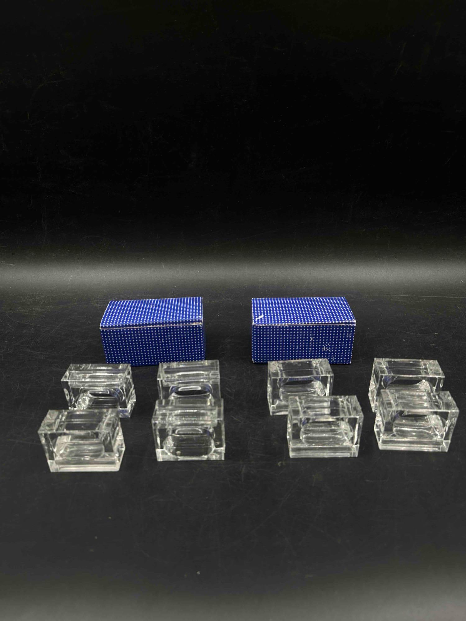 Lilian Vernon Lucite Napkin and Flower Holders Set: Decorative Lucite napkin and flower holders by Lilian Vernon, featuring elegant design and packaged in original presentation box. Medium: Lucite