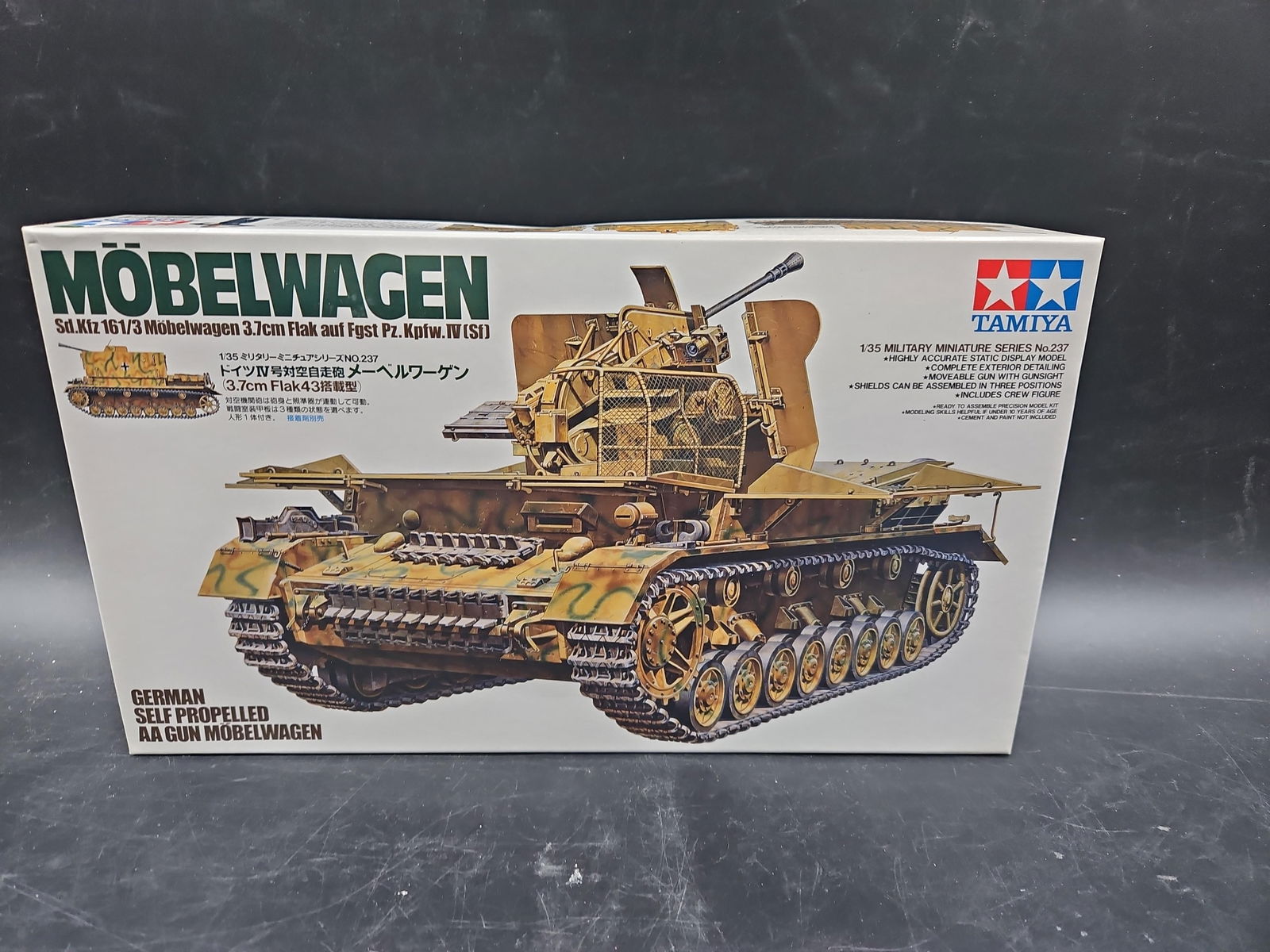 Tamiya Möbelwagen German Self-Propelled AA Gun Model Kit No. 237: A 1:35 scale plastic model kit by Tamiya from the Military Miniature Series No. 237. Depicts the German WWII Möbelwagen (Sd.Kfz. 161/3), a Panzer IV-based self-propelled anti-aircraft gun armed with