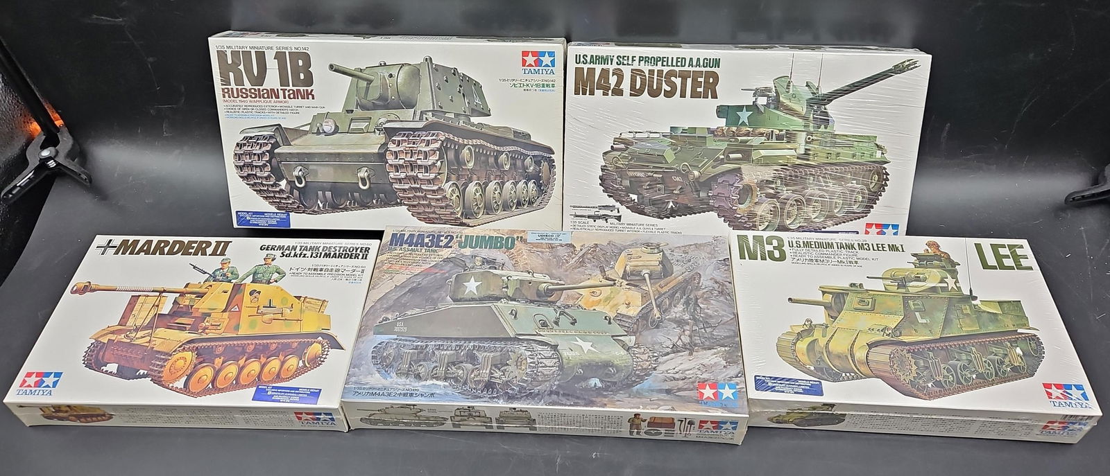Collection of Tamiya 1/35 WWII and Cold War Armor Model Kits: Lot of five vintage Tamiya 1/35 scale plastic model kits featuring both World War II and postwar armored vehicles. Includes KV-1B Russian Tank, M42 Duster US Army Self-Propelled A.A. Gun, Marder II Ge
