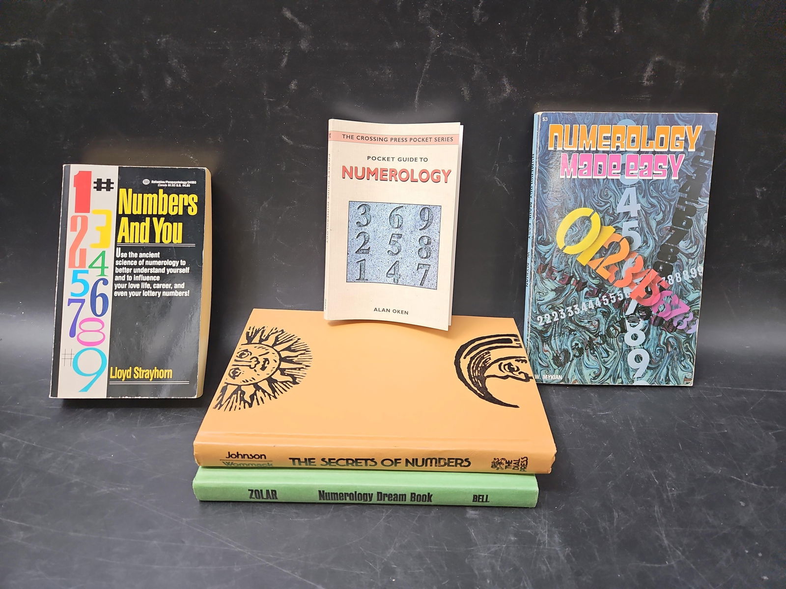 Collection of Numerology Books (6 Volumes): A lot of six vintage and modern books on numerology, covering divination, symbolic meaning of numbers, and practical guides to understanding life through numbers. Titles include: Numbers and You by L