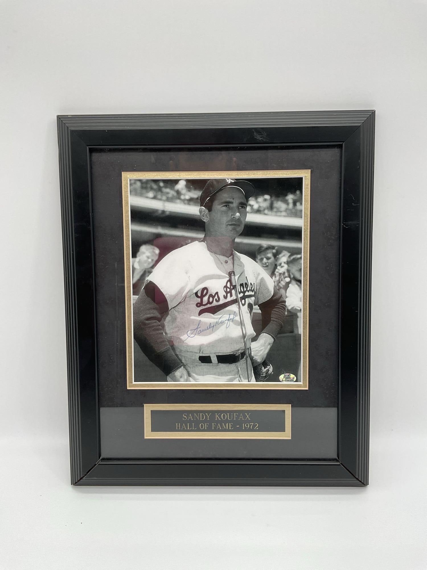 Sandy Koufax Signed Hall of Fame Photo with COA: Framed black and white photograph of legendary Dodgers pitcher Sandy Koufax, signed in blue ink. Captioned "Hall of Fame – 1972" and accompanied by a STAT Authentic certificate and matching