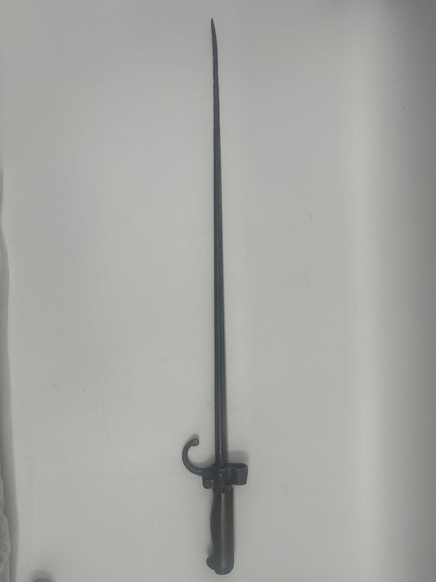 WWI FRENCH REPUBLIC 1916 "ROSALIE" LEBEL BAYONET: Description: Antique metal socket bayonet featuring a long tapered blade, ribbed grip, and prominent curved handguard. This bayonet was designed for use with the Leder rifle and was nicknamed "Ro