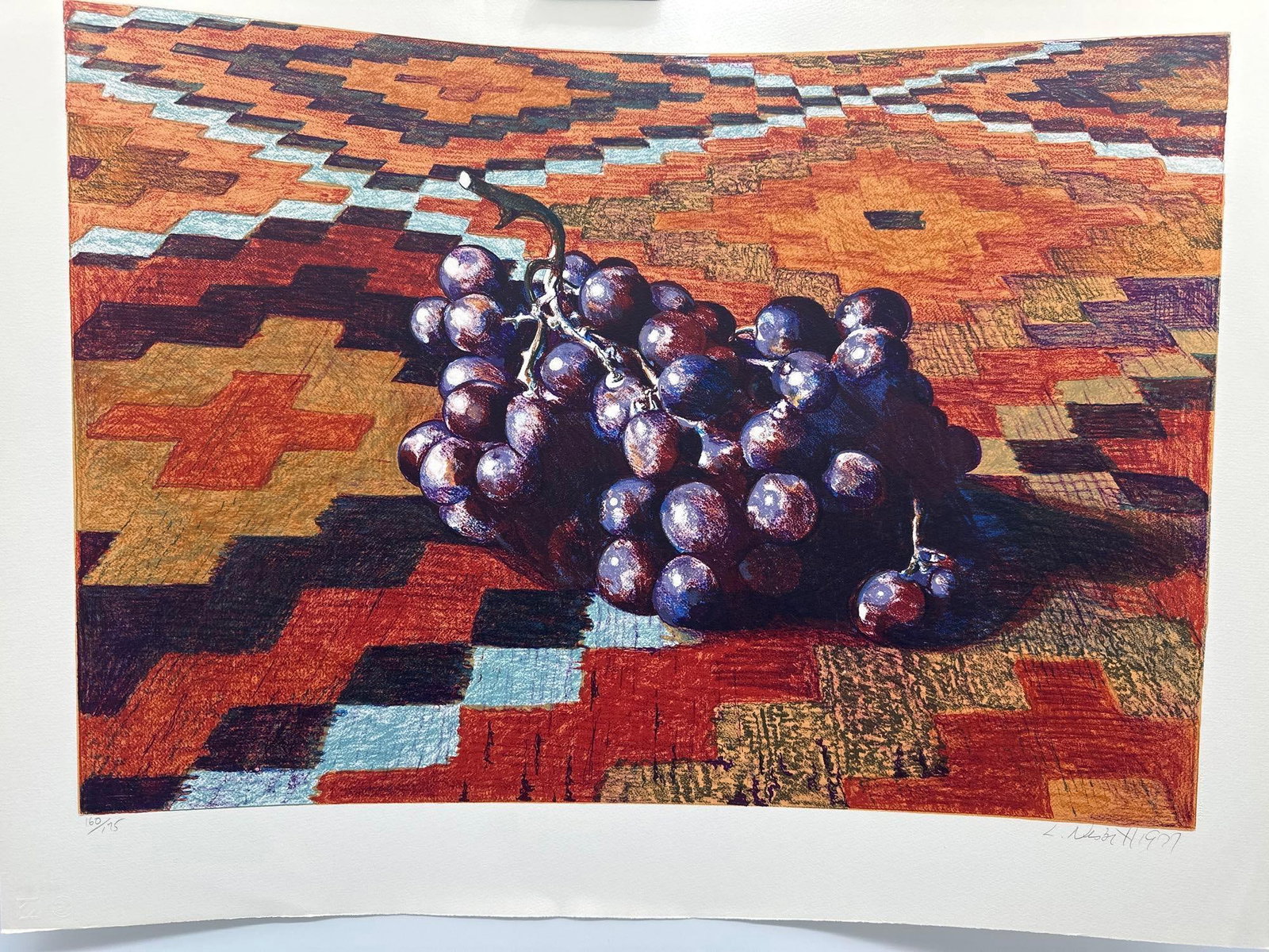 Lowell Nesbitt Grapes Hand Signed & Numbered ART: Realistic still life of purple grapes resting on a colorful patterned rug Artist: Lowell Nesbitt Title: Grapes Medium: Screenprint Signed: Hand Signed <