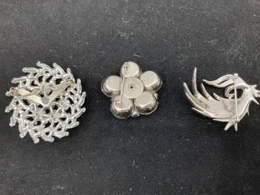 Group of vintage rhinestone brooches
