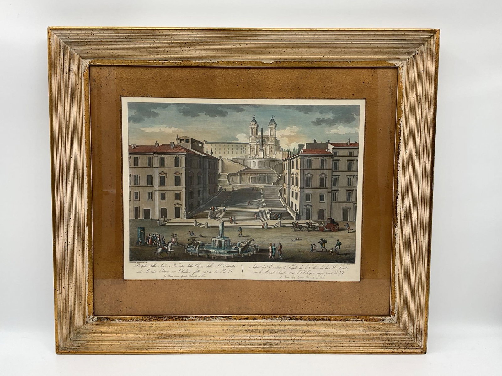 Colored Engraving of the Column of Marcus Aurelius - Pietro Ruga: Hand-colored engraving depicting the iconic Spanish Steps leading to the Church of Trinità dei Monti in Rome, with figures, horses, and a fountain in the foreground. Includes Italian and French
